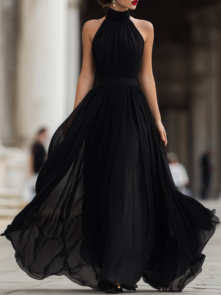 Stylish women's black halter neck pleated long maxi dress, ideal for evening events & special occasions.
