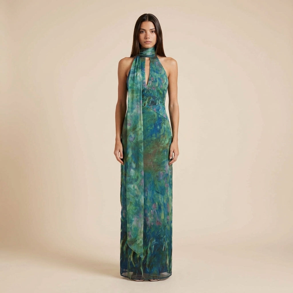 Women's elegant halter neck printed maxi dress with open back, perfect for summer vacations & special occasions.
