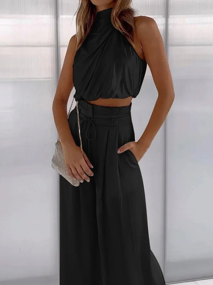 Women's high-waist wide-leg pants & matching halter top. Elegant two-piece set, comfortable and chic for parties.