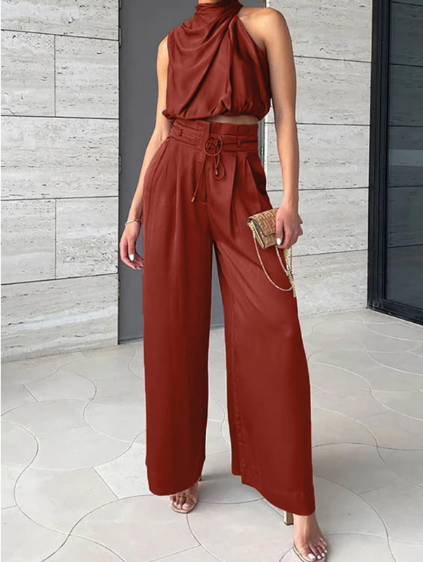 Autumn-ready women's elegant two-piece outfit: sleek halter top & wide-leg pants. Coordinated evening wear style.