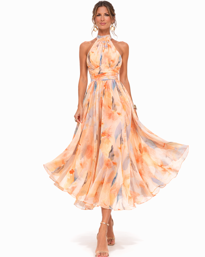 Stunning watercolour print halterneck maxi dress for women, ideal for elegant summer occasions. Sleeveless and chic.