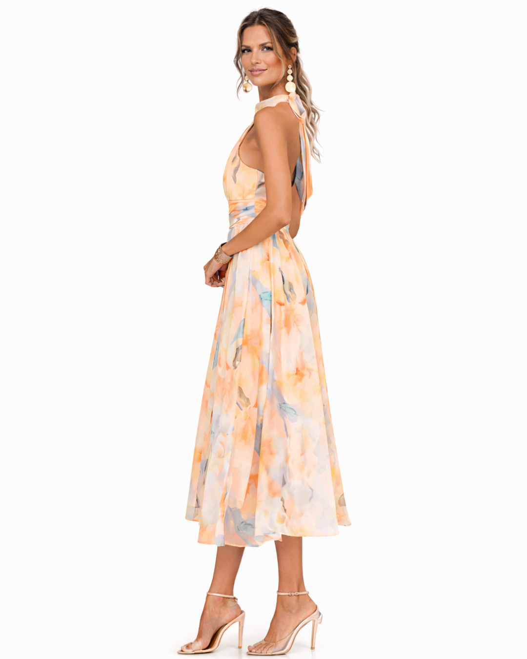 Chic women's halterneck maxi dress featuring a beautiful watercolour print, perfect for casual or boutique summer style.
