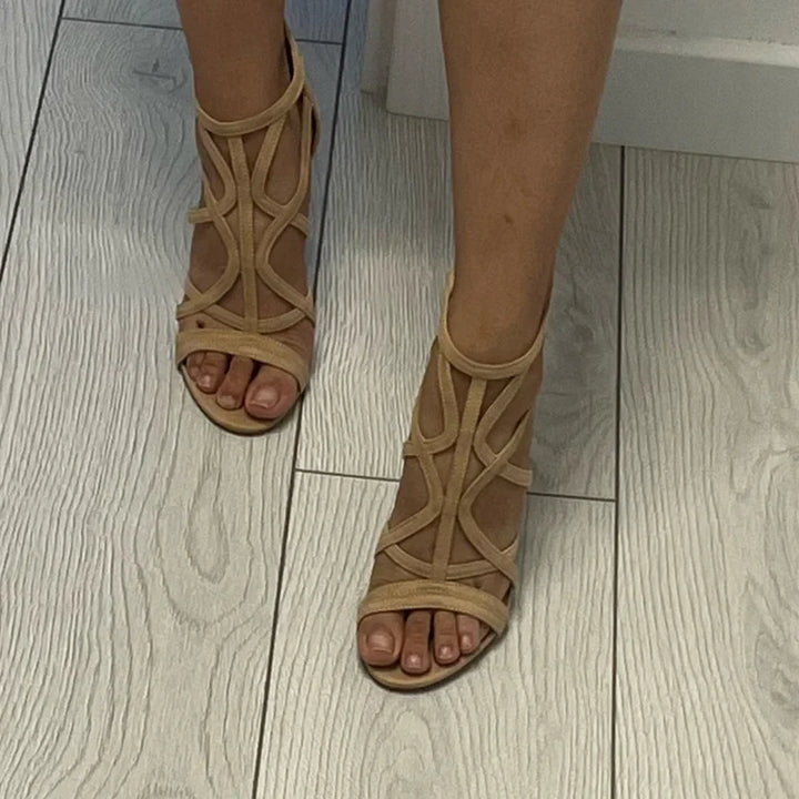 Front view: Open toe elegant heeled gladiator sandals for women, ideal summer shoes.