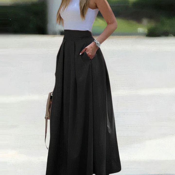 Flowy high-waist pleated maxi skirt for women, ideal for spring, summer, or autumn fashion.