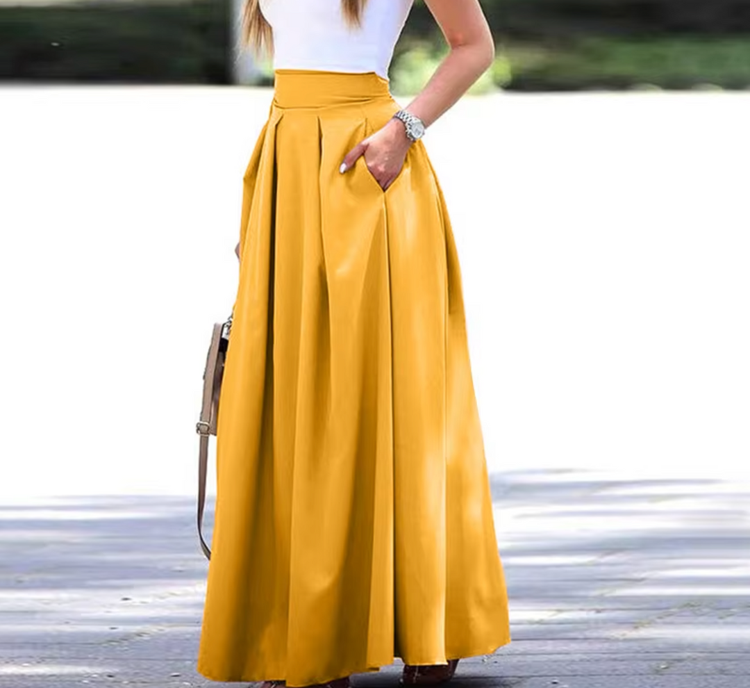 Chic women's high waist pleated maxi skirt, offering elegant style and comfortable flowy wear.