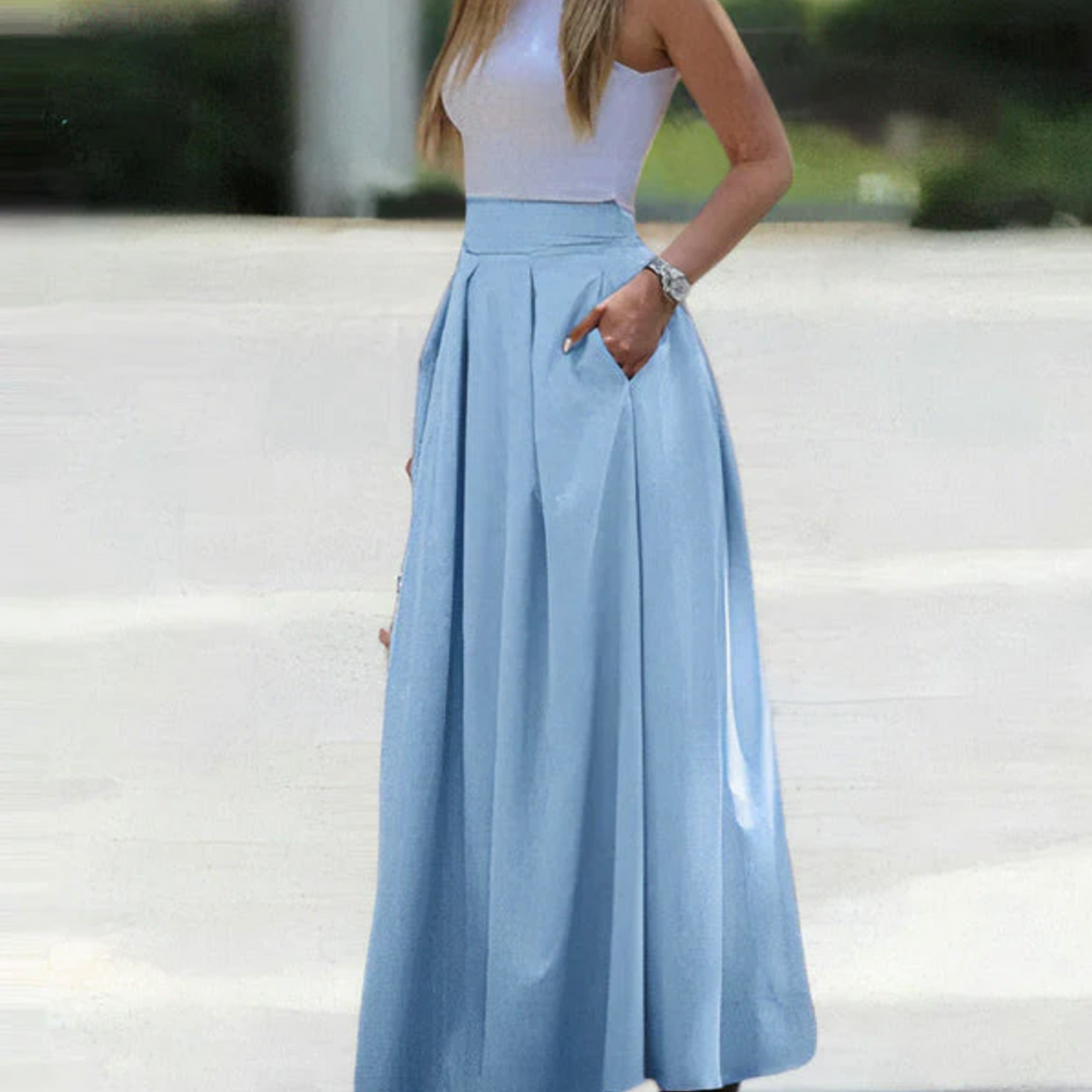 Women's apparel: elegant pleated high waist maxi skirt, a long, flowy piece for modern fashion.