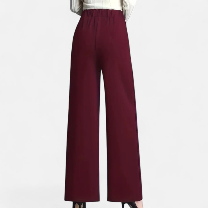 Women's dress pants in a classic black hue, high-waist and wide-leg for a sophisticated look.