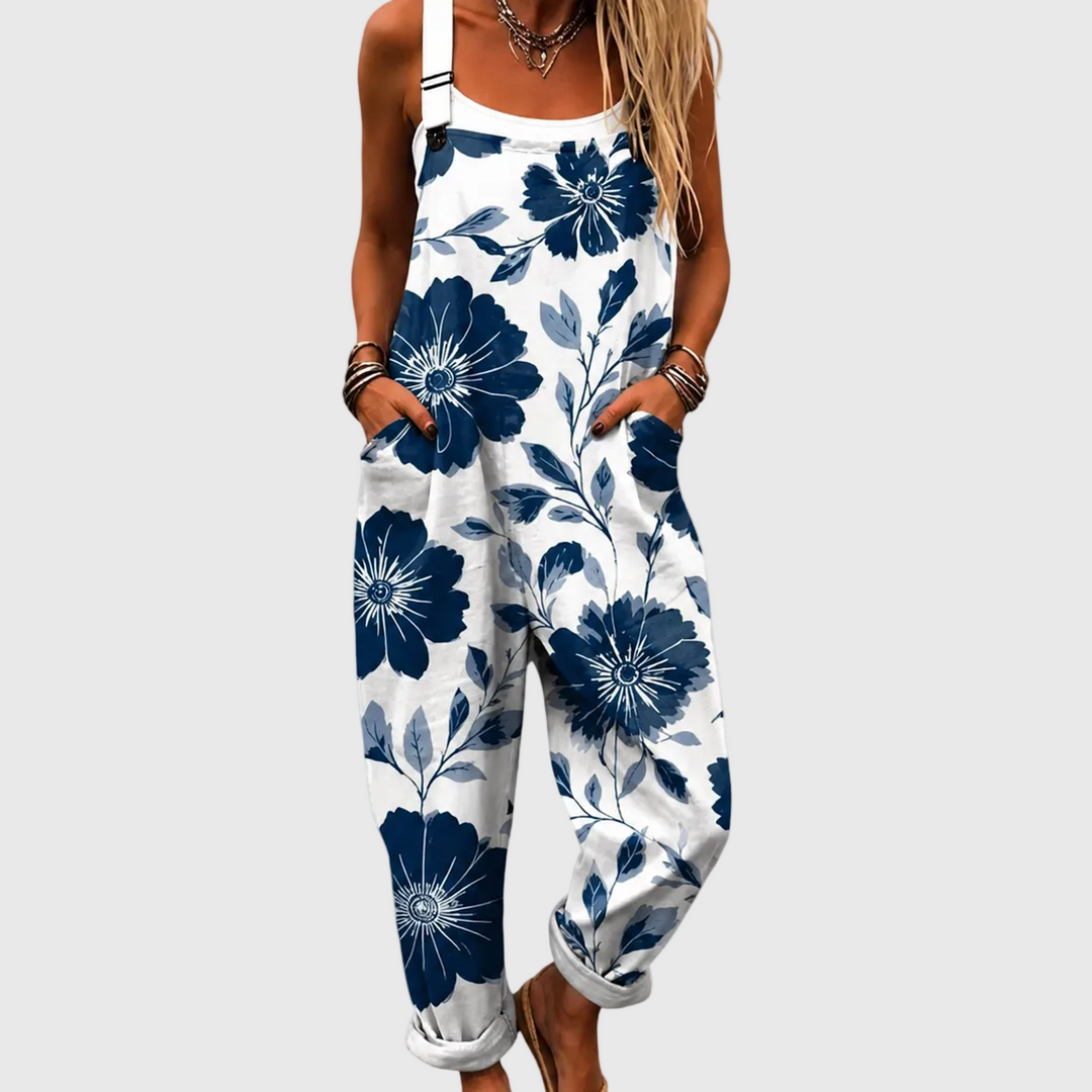 Women's elegant indigo floral overalls jumpsuit with adjustable straps, relaxed fit, and pockets for summer.