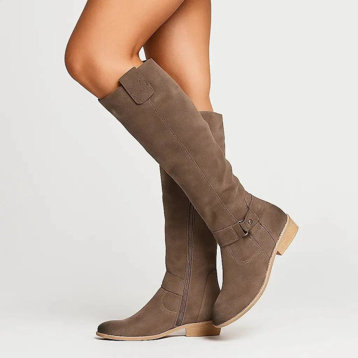 Versatile women's knee-high block heel boots in black, brown, beige, & dark green suede for elegant winter looks.