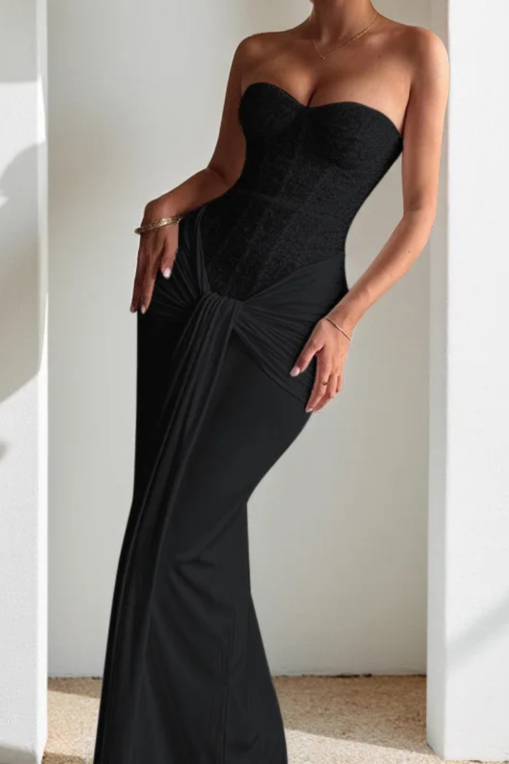 Chic strapless lace corset maxi dress for wedding guests. Features draped details & a timeless, elegant style.