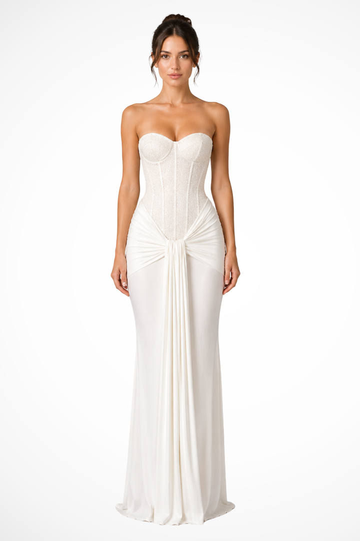 Formal women's evening gown: strapless, lace corset bodice, & flowing draped maxi skirt for special occasions.