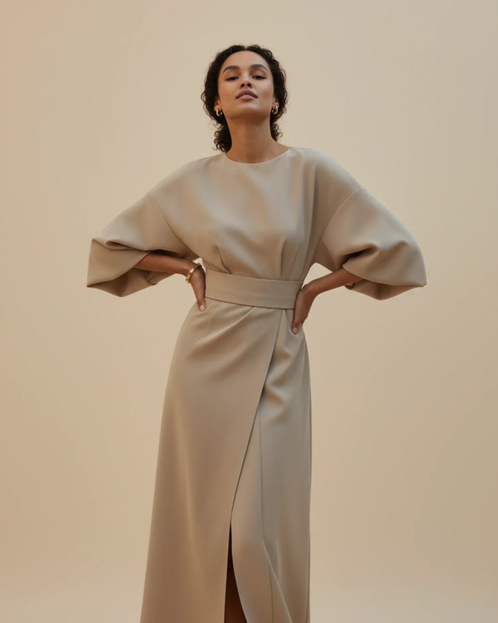 Trendy women's midi dress with a contemporary wrap style and belted detail.