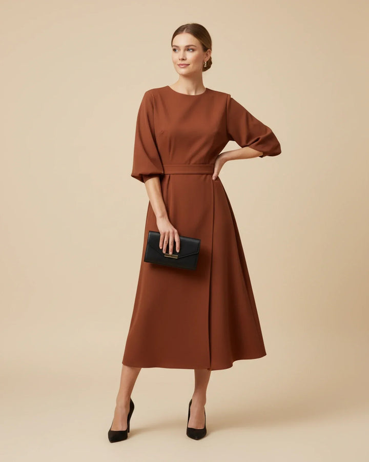 Elevate your wardrobe with this women's lantern sleeve midi dress.