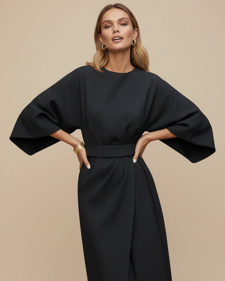 Chic midi dress featuring a flattering wrap design and dramatic lantern sleeves.