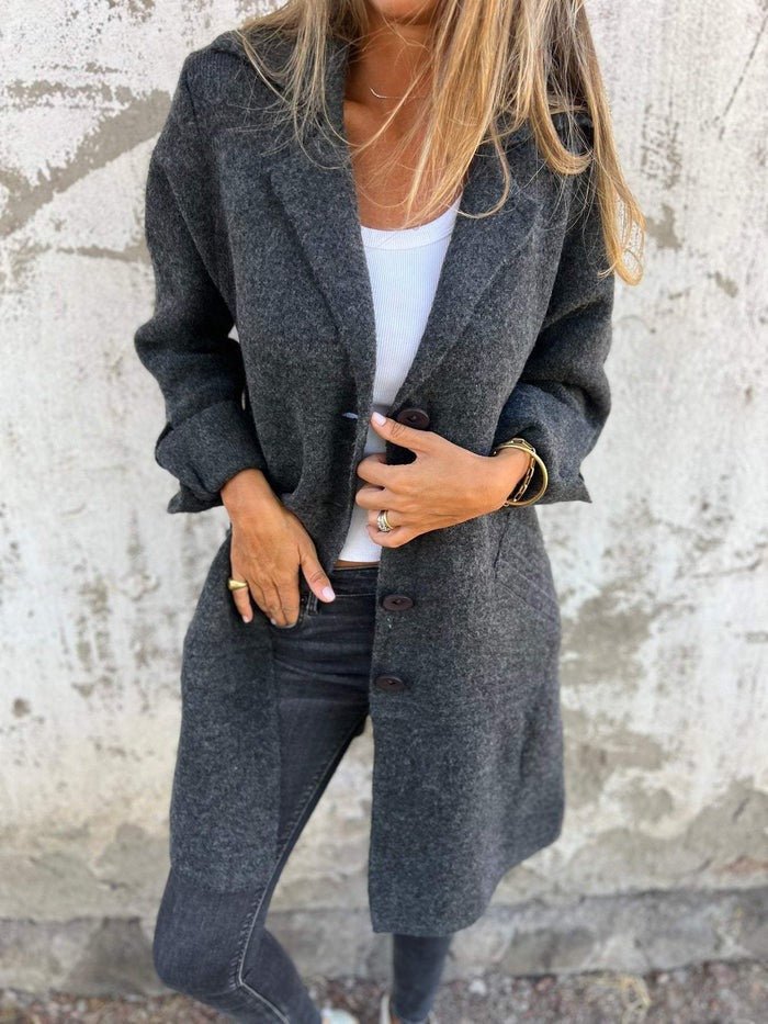 Elegant women's solid color lapel collar jacket, button-front design, versatile winter fashion outerwear.