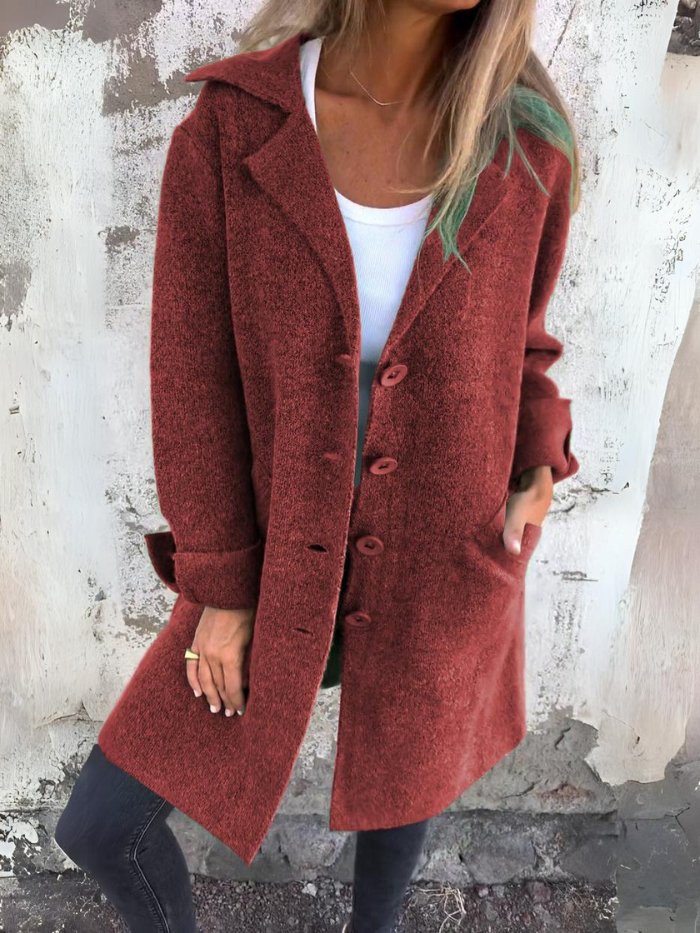 Women's classic lapel collar button-front long coat, elegant solid color design for timeless autumn style.