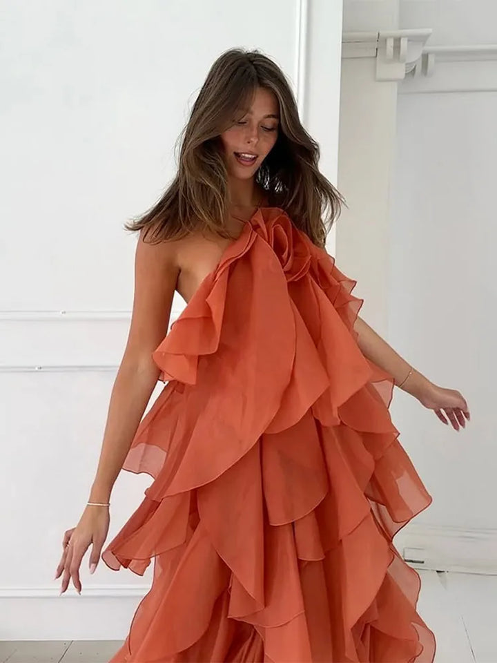 Feminine women's maxi dress featuring layered ruffles and an elegant floral neckline. Ideal for spring parties.