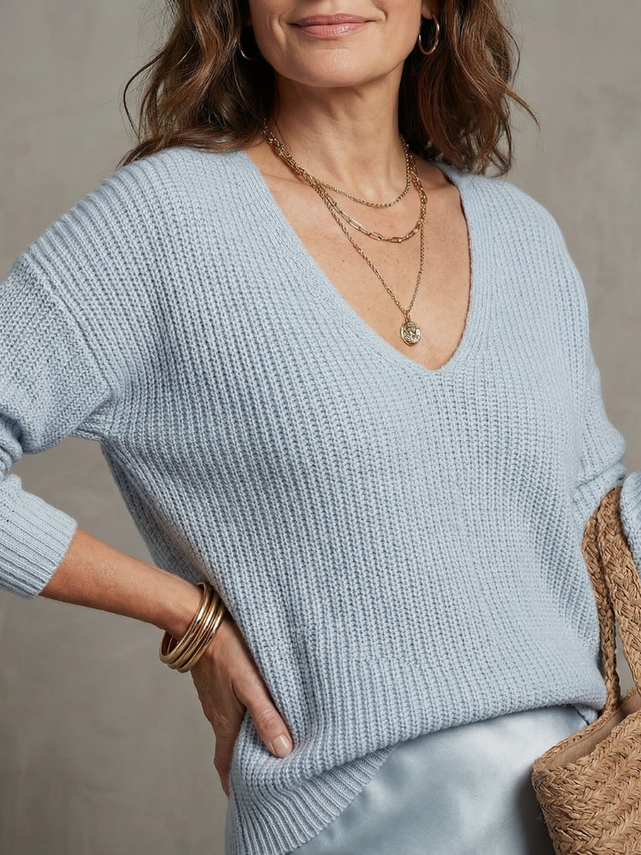 Fall fashion women's set: comfortable layered sweater with a fluid bias-cut midi skirt.