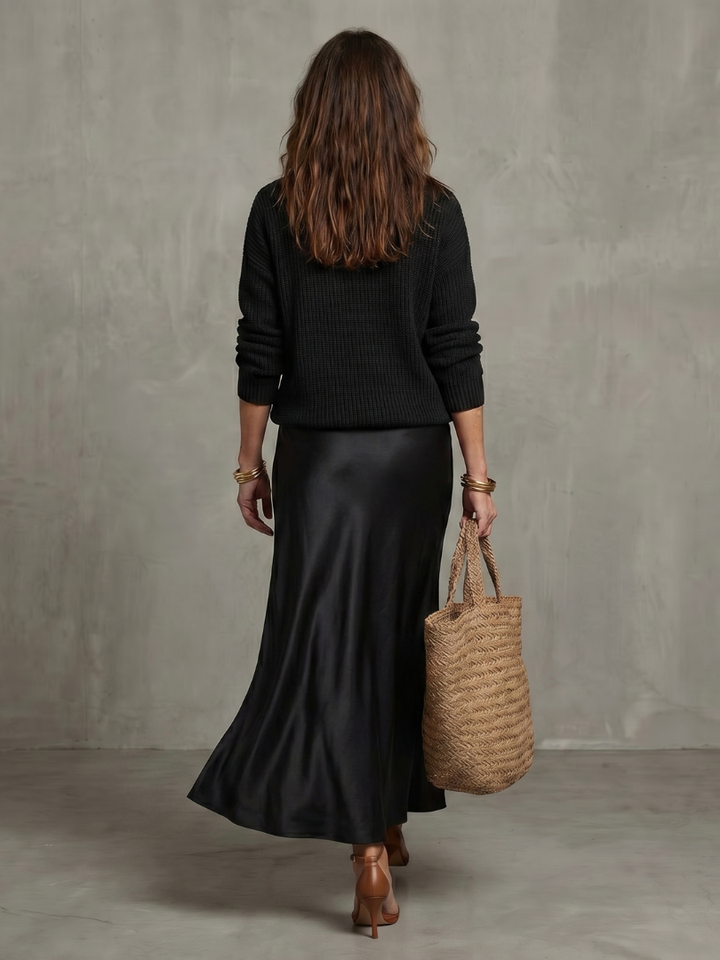 Sophisticated women's layered sweater & elegant midi skirt set. Ideal for fall fashion.
