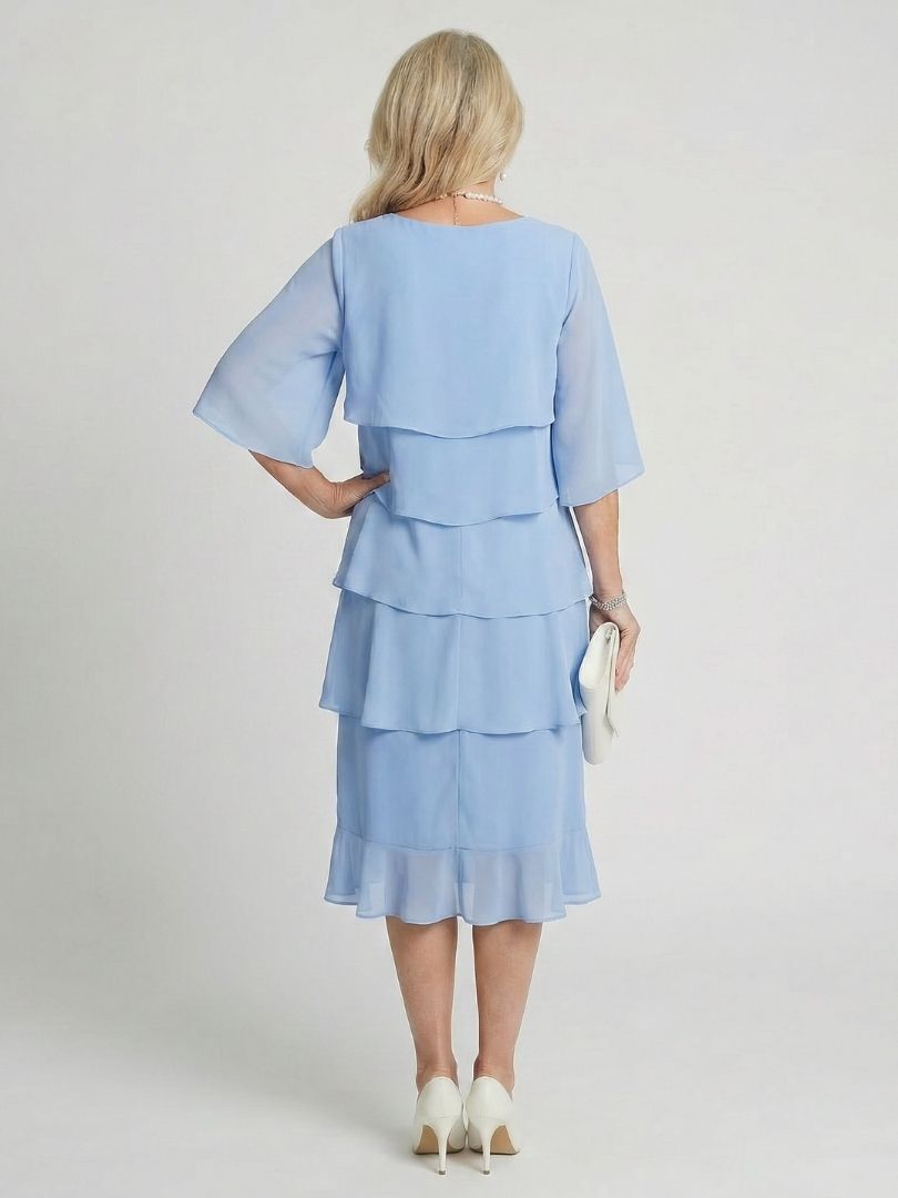 Beautiful women's elegant midi dress with a layered tiered skirt, ideal for summer occasions.