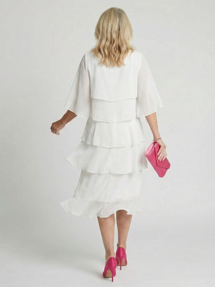 Elegant women's summer dress, layered tier midi length, combines fashion with relaxed comfort.