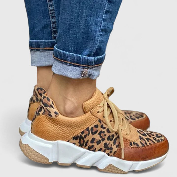 Women's elegant leopard print sneakers for stylish comfort & arch support. Perfect fashion walking shoes.