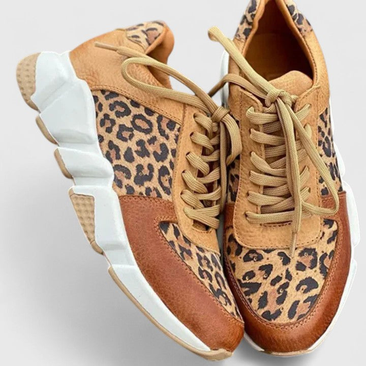 Chic women's leopard print sneakers. Stylish footwear for an active lifestyle, offering comfort & fashion.