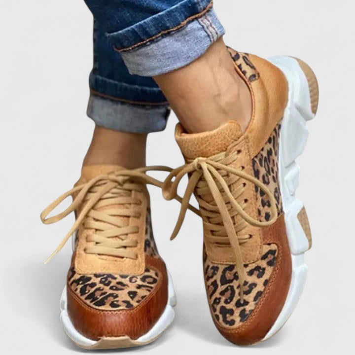 Fashionable women's leopard print sneakers with arch support. Elegant and comfortable for daily wear.