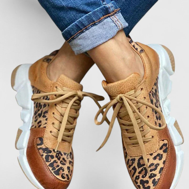 Comfortable women's leopard print sneakers featuring elegant design & arch support for all-day style.