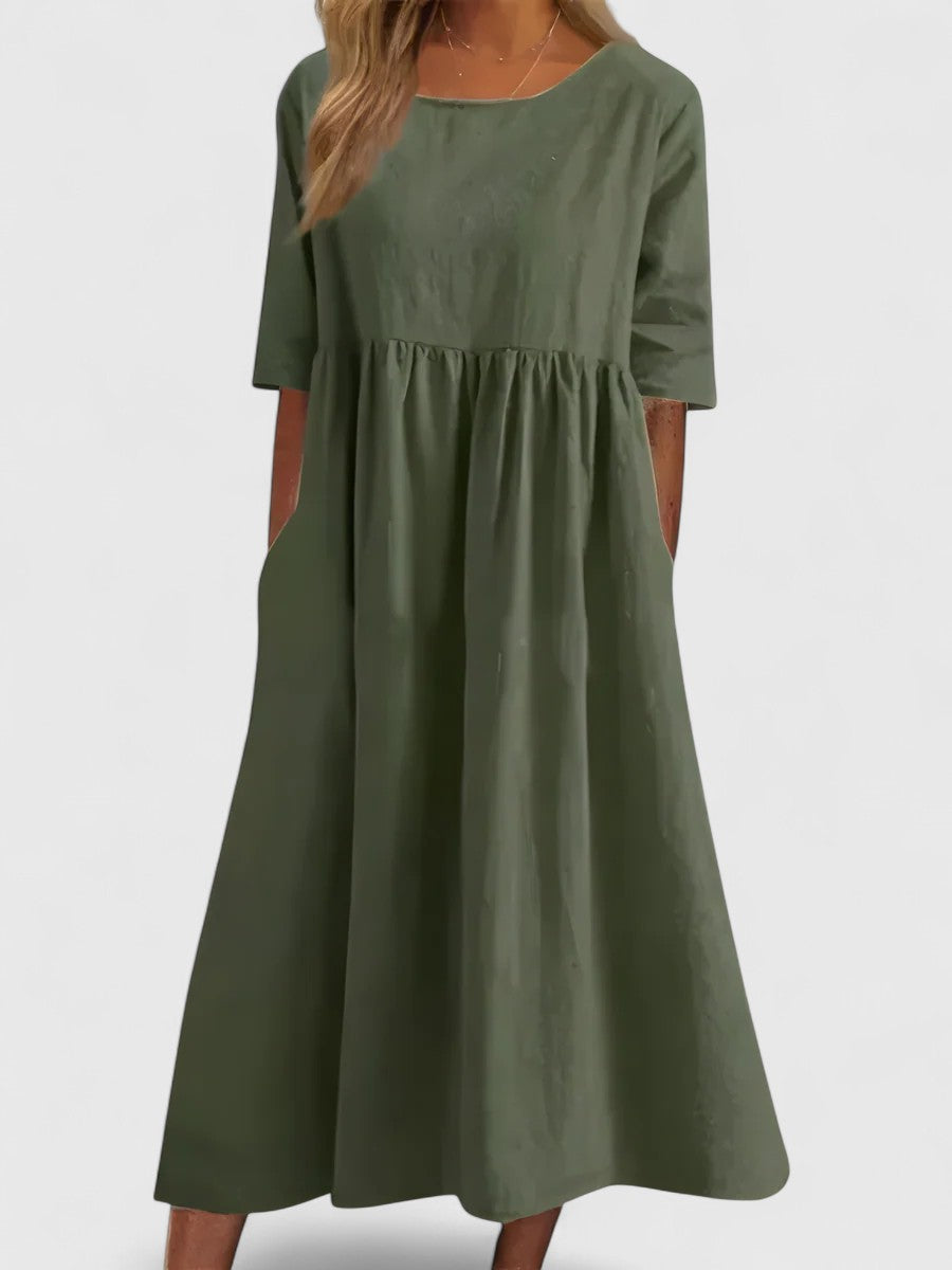 Versatile women's everyday maxi dress with round neck, cinched waist, and pockets.