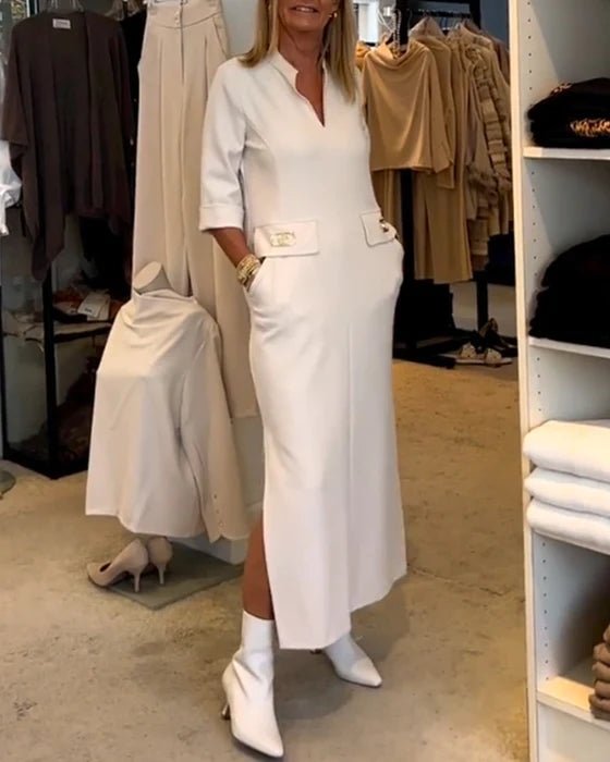 Women's elegant lightweight white midi dress with a feminine silhouette, perfect for spring.