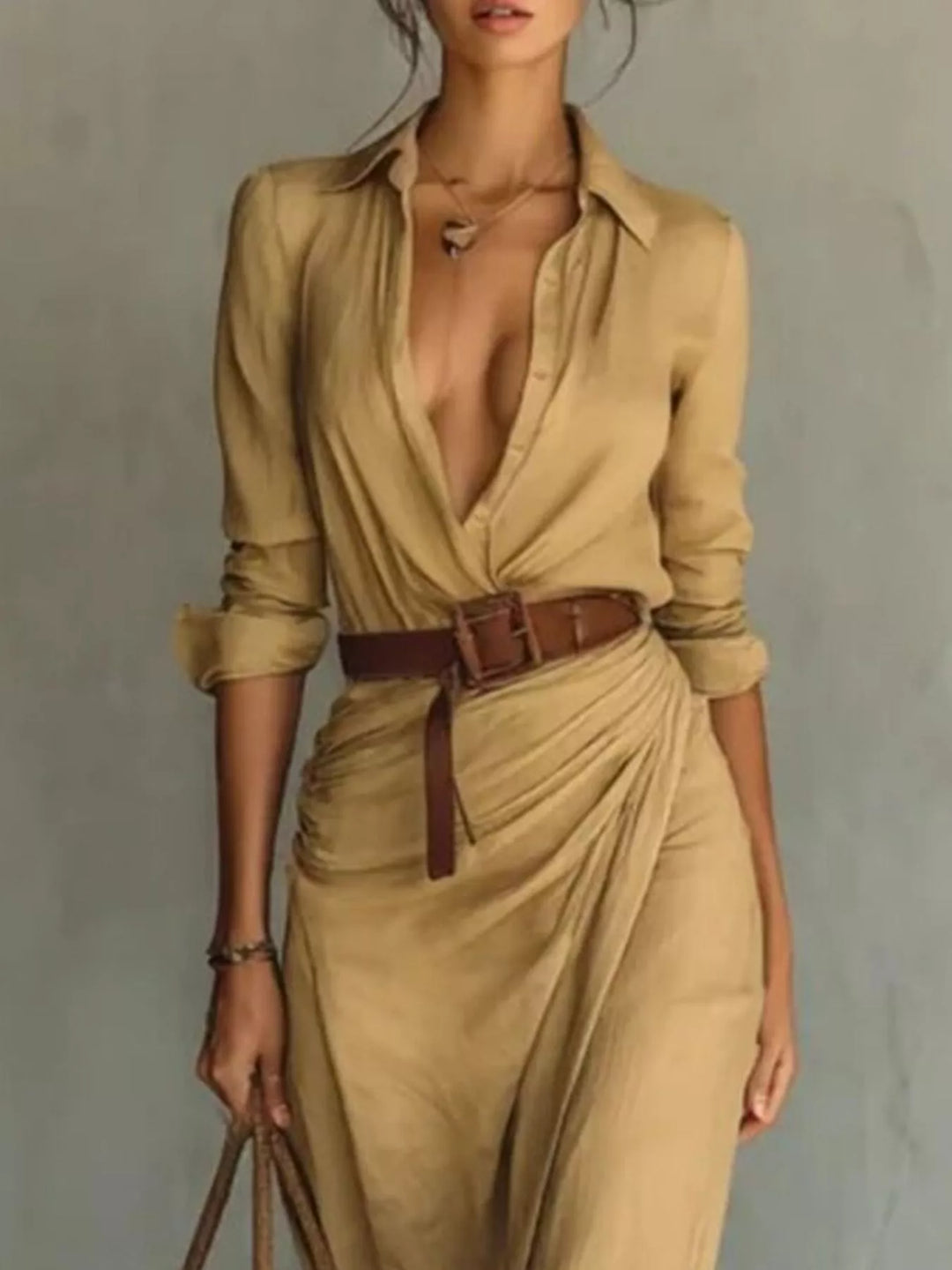 Modest long sleeve women's maxi dress with an elegant belt, suitable for formal or casual wear.
