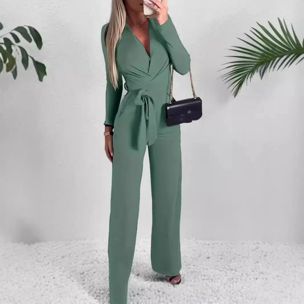 Women's elegant long-sleeve V-neck wide-leg jumpsuit with a stylish tie waist, perfect for casual or formal wear.