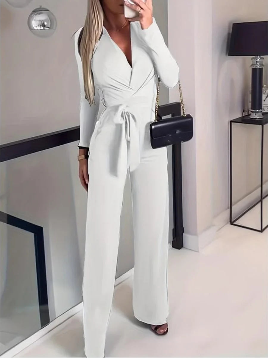Versatile women's V-neck long-sleeve jumpsuit with wide legs and tie waist, creating a comfortable, elegant silhouette.