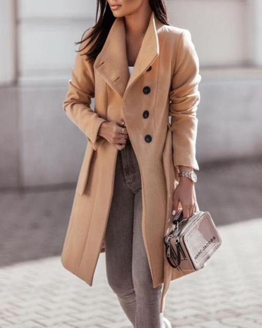 Women's elegant longline double-breasted winter coat with a stylish tie waist, perfect for cold weather.
