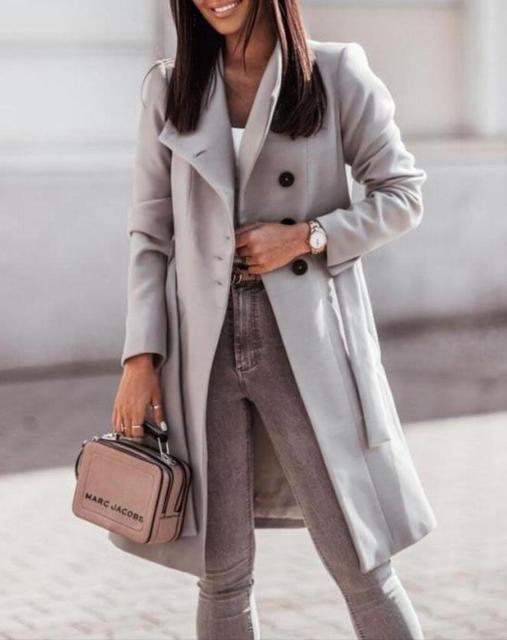 Sophisticated women's double-breasted longline winter coat, cinched tie waist creates a flattering silhouette.