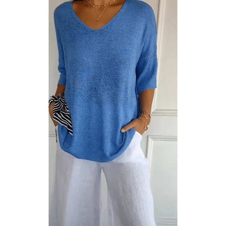 Casual chic women's knit top, featuring a relaxed fit, V-neck, and stylish half sleeves.