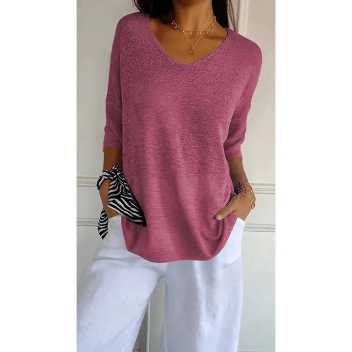 Versatile women's summer blouse; soft knit fabric, comfortable loose fit, V-neck, half sleeves.