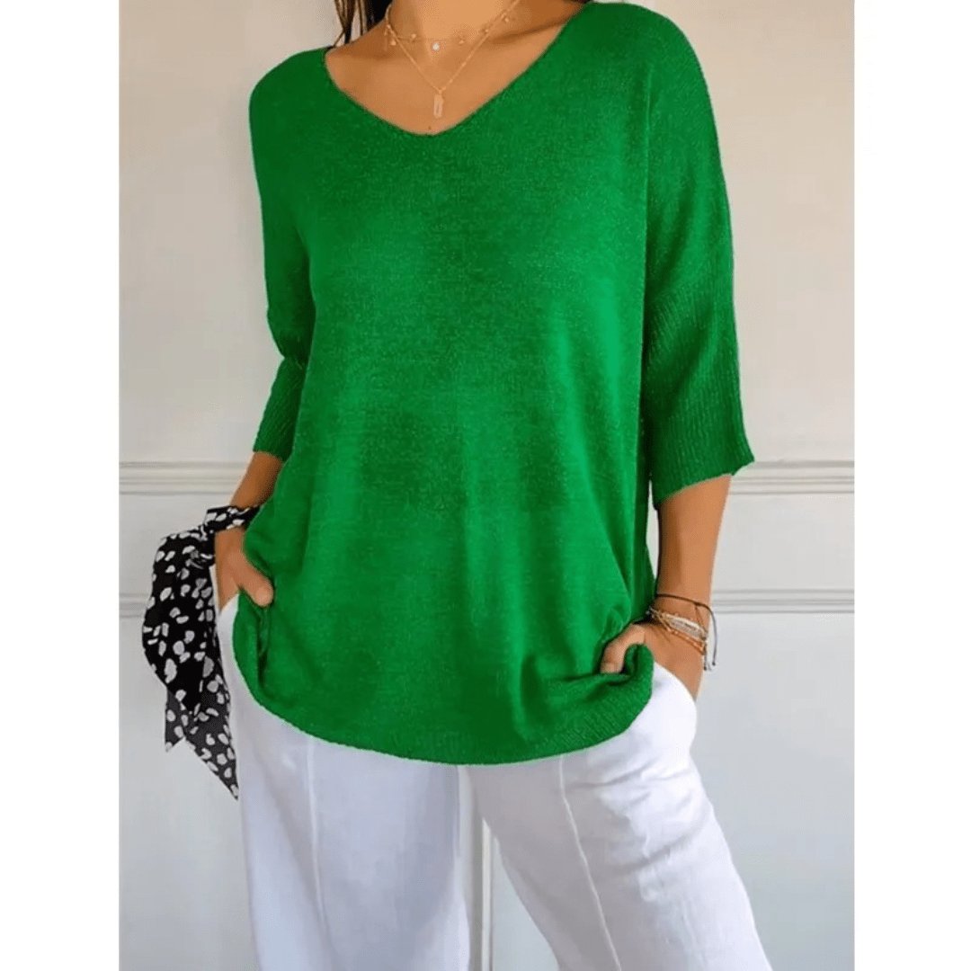 Stylish women's workwear blouse, a loose knit top with an elegant V-neck and practical half sleeves.