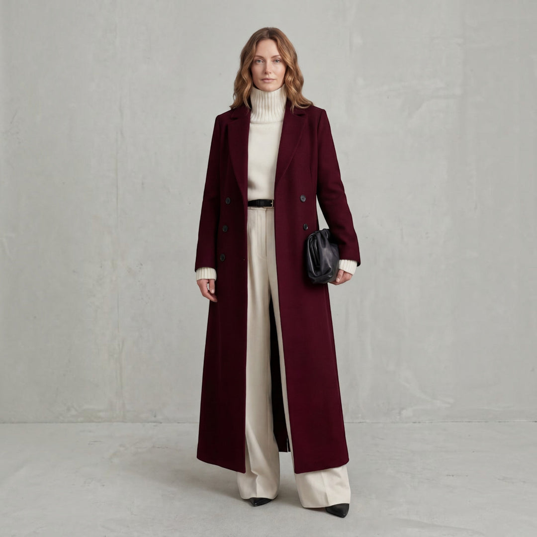 Chic women's double-breasted maxi trench coat with long sleeves, perfect for winter fashion.