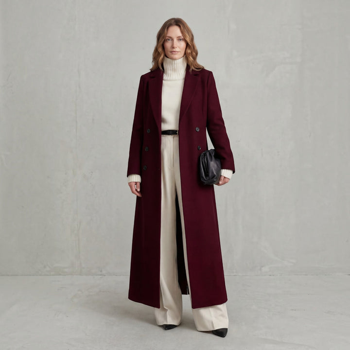 Chic women's double-breasted maxi trench coat with long sleeves, perfect for winter fashion.