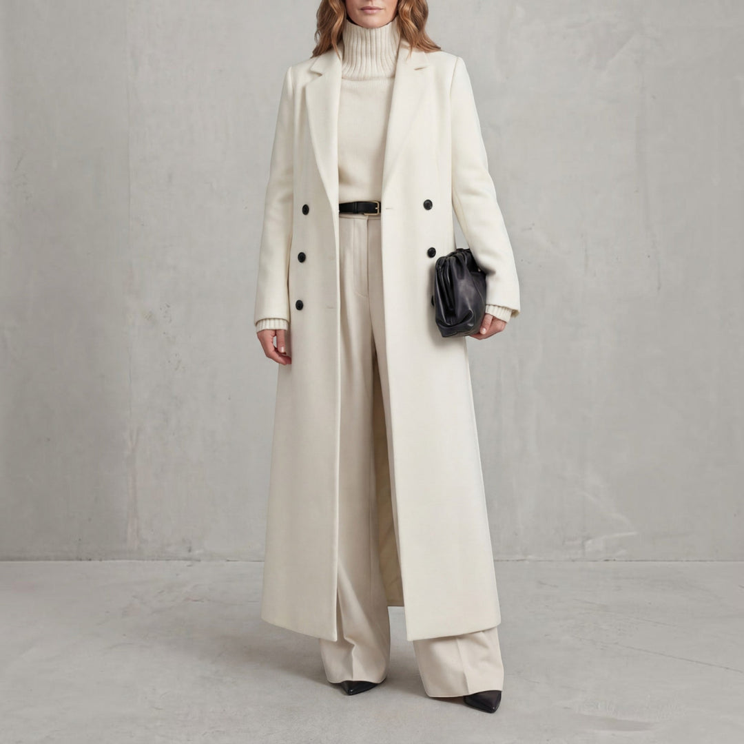 Fashionable women's double-breasted long winter coat, elegant maxi length outerwear for cold weather.