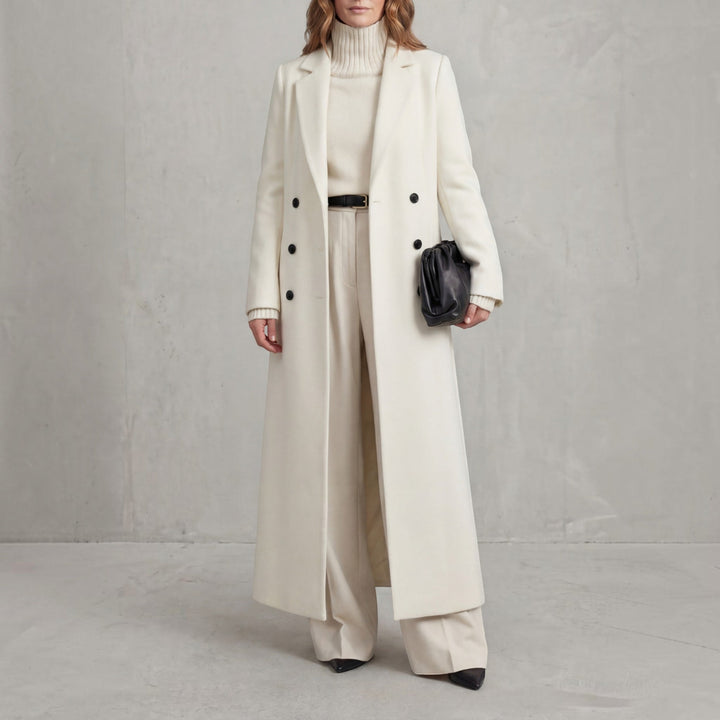 Fashionable women's double-breasted long winter coat, elegant maxi length outerwear for cold weather.