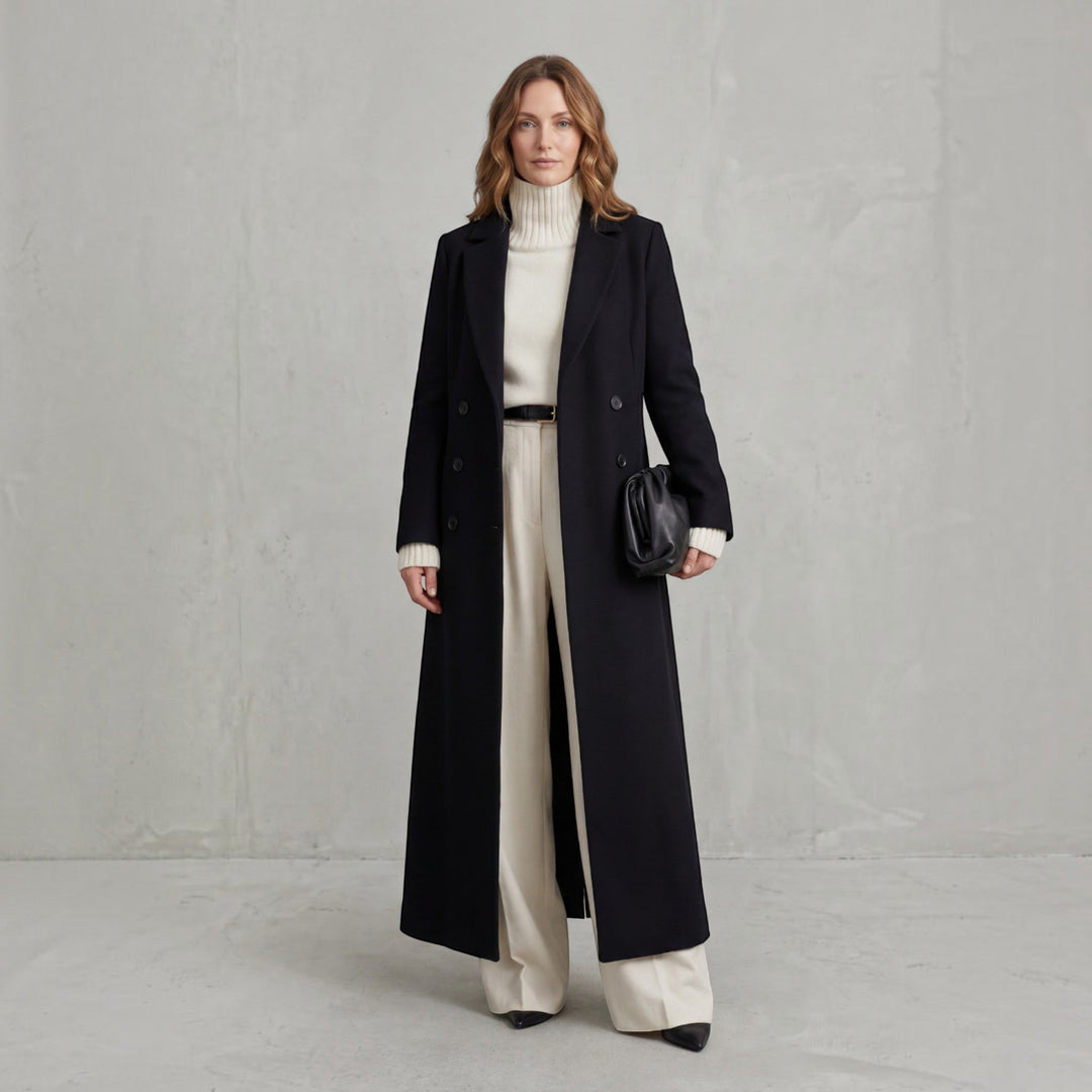 Double-breasted women's maxi trench coat, elegant winter outerwear, classic fashion jacket.