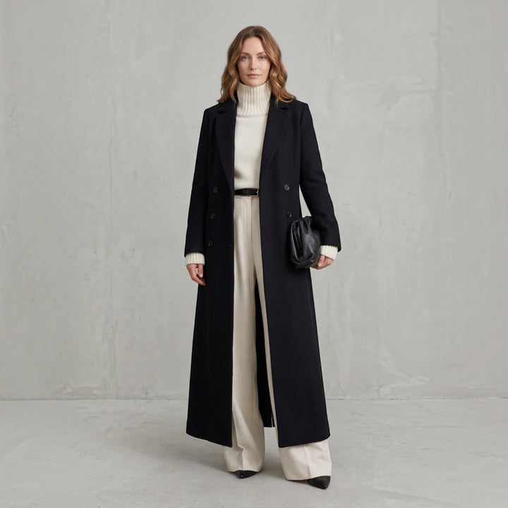 Double-breasted women's maxi trench coat, elegant winter outerwear, classic fashion jacket.