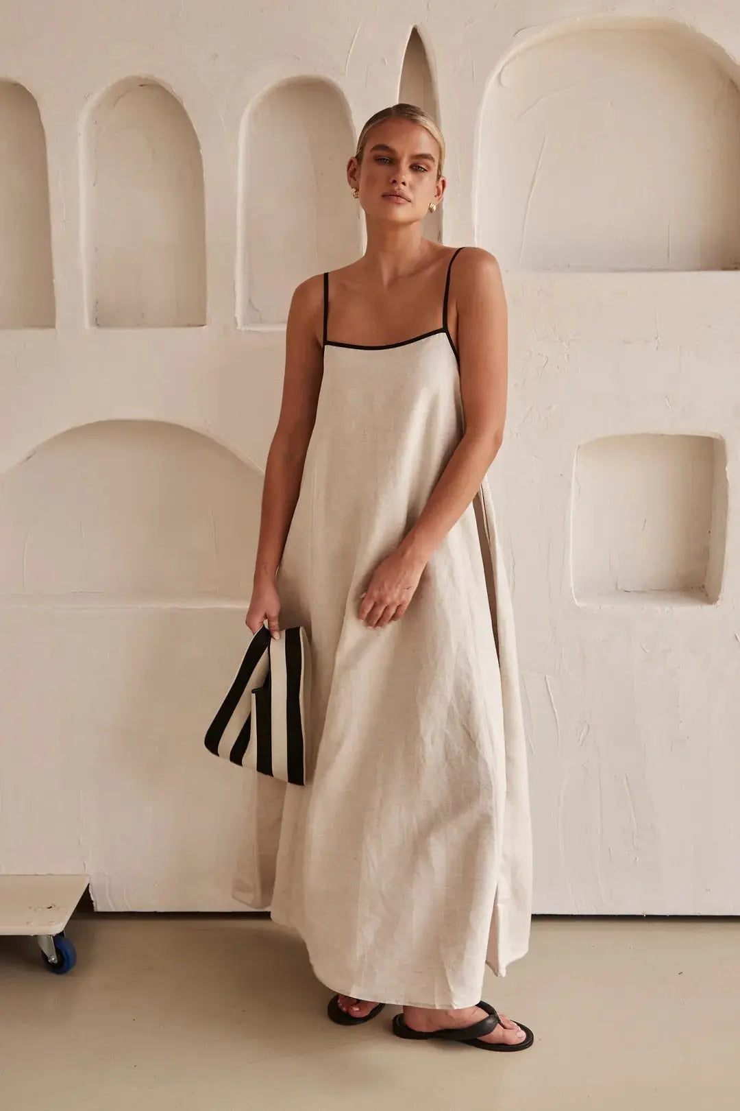 Women's elegant maxi summer dress with contrast trim, adjustable straps, and side pockets. Perfect for vacation.