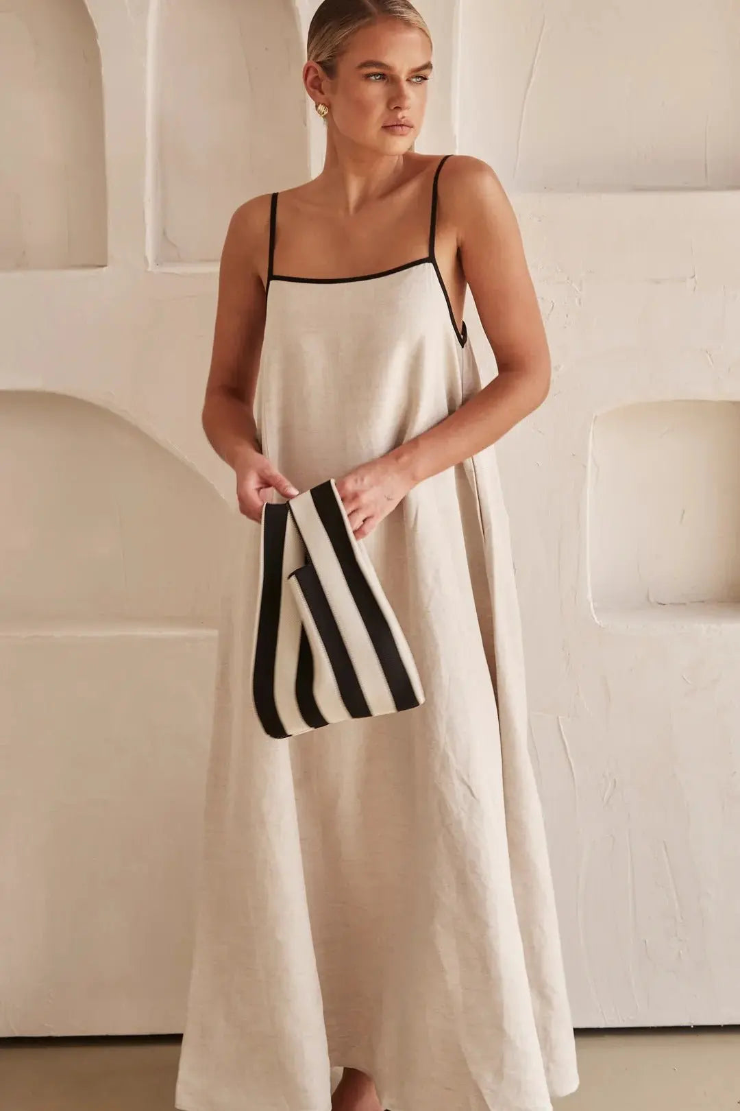 Elegant women's vacation maxi dress, a perfect summer resortwear piece with contrast trim and adjustable spaghetti straps.