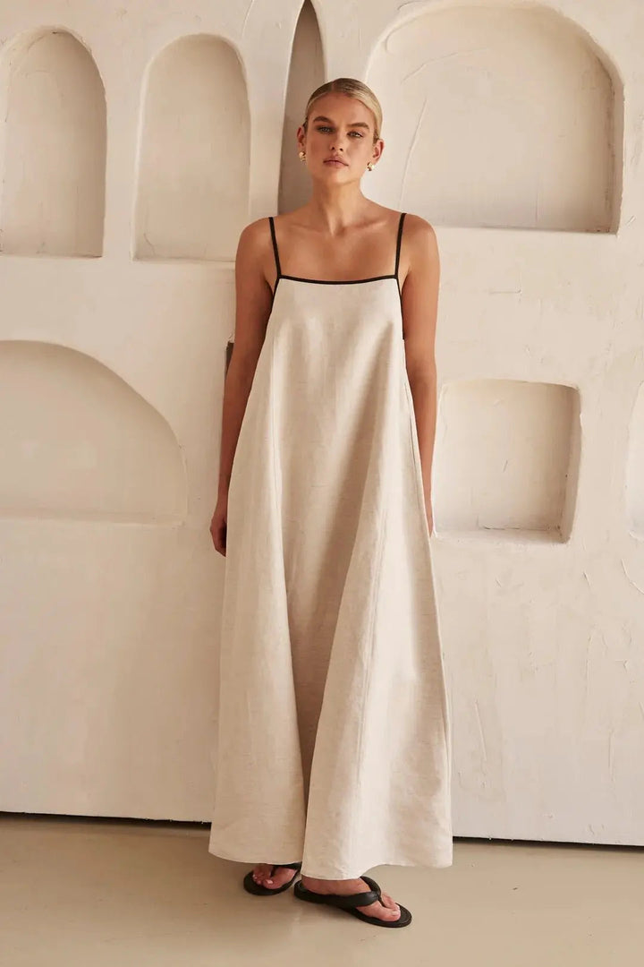 Relaxed trapeze fit women's summer maxi dress with eye-catching contrast trim and customizable adjustable straps.