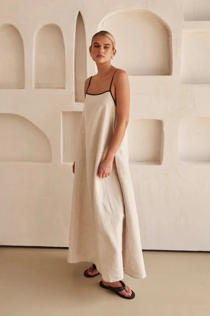 Stylish women's beach maxi dress, ideal resortwear. Features comfortable adjustable straps and a modern contrast trim design.