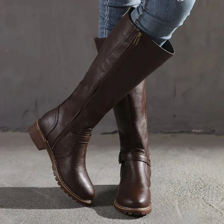 Stylish and comfortable women's leather boots with a mid-calf height and chic heel.